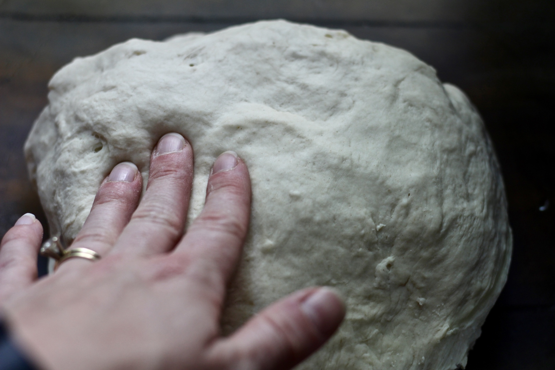 Dough ball tacky to the touch.