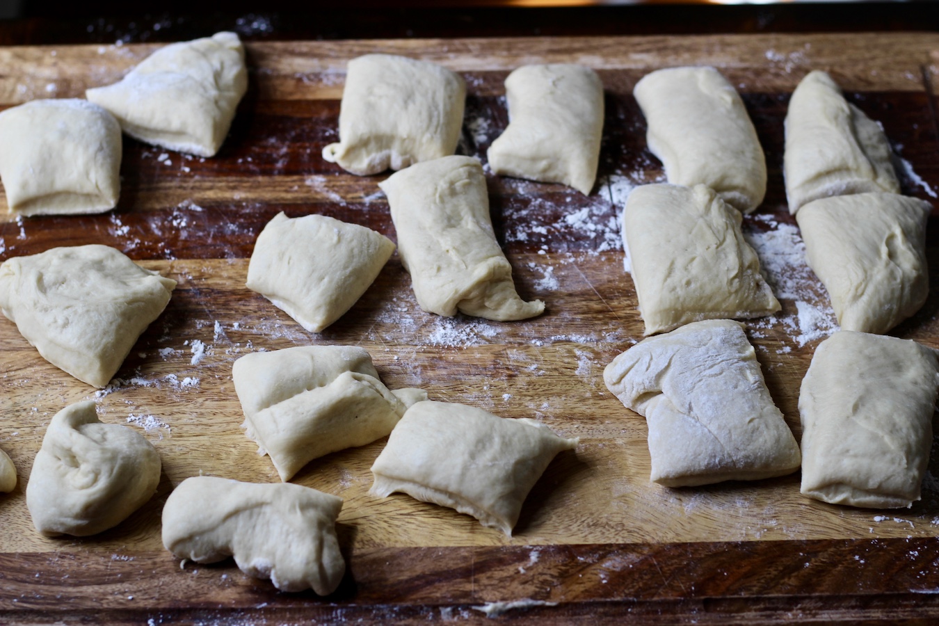 Raw garlic knots dough before being knotted.