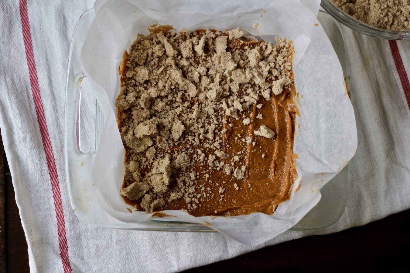 Pumpkin Spice Coffee Cake with strudel topping on half.