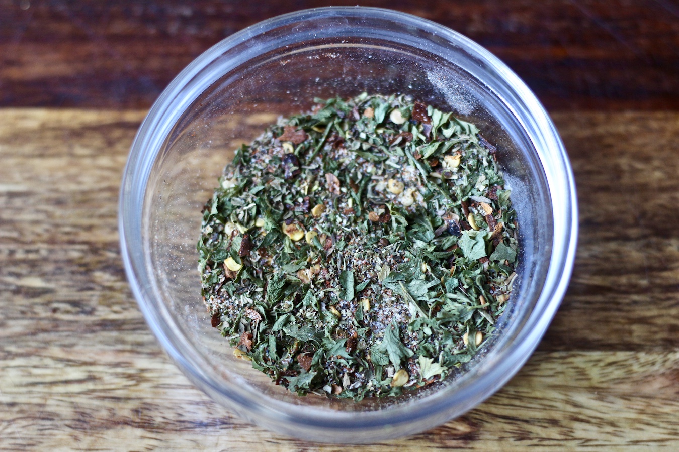 A small glass bowl of seasoning for Turkey Mac.