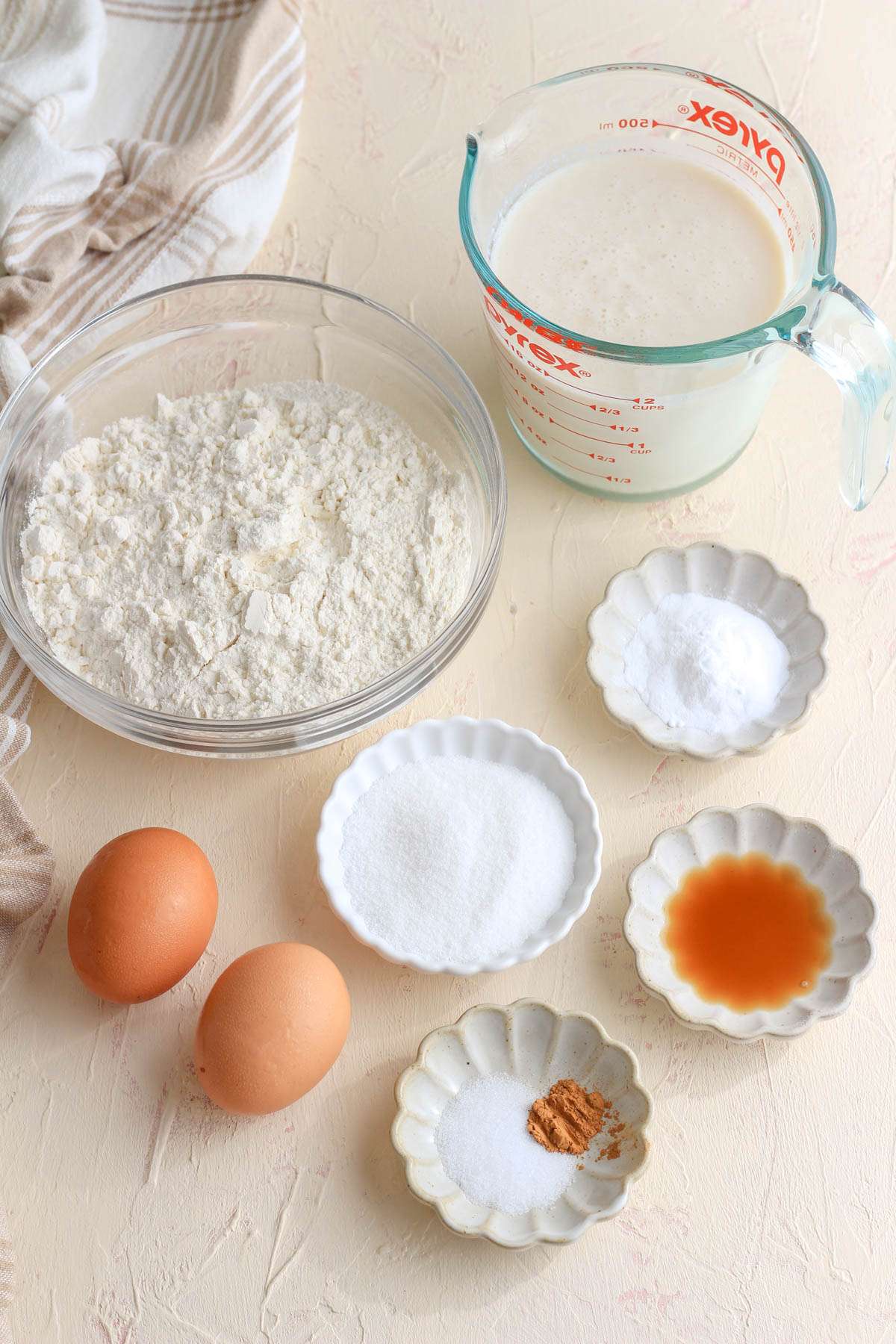 Ingredients for dairy-free buttermilk pancakes on a cream counter.
