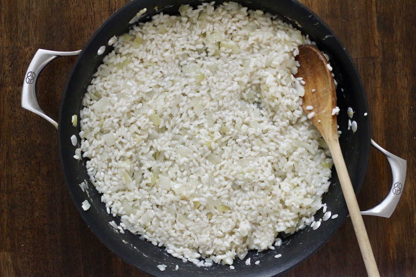 Risotto after the liquid has been incorporated into the rice.