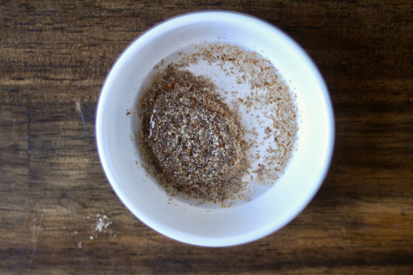 Ground flaxseed meal mixed with water in a small bowl.