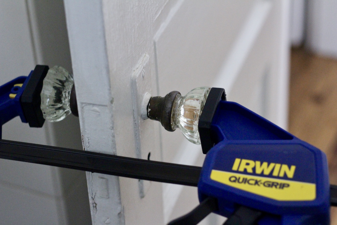 Clamp holding a door knob in place.