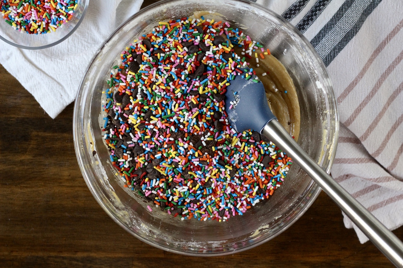 A glass bowl with cookie cake batter