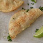 A crispy oven baked sweet potato taco on a baking sheet with parchment paper.