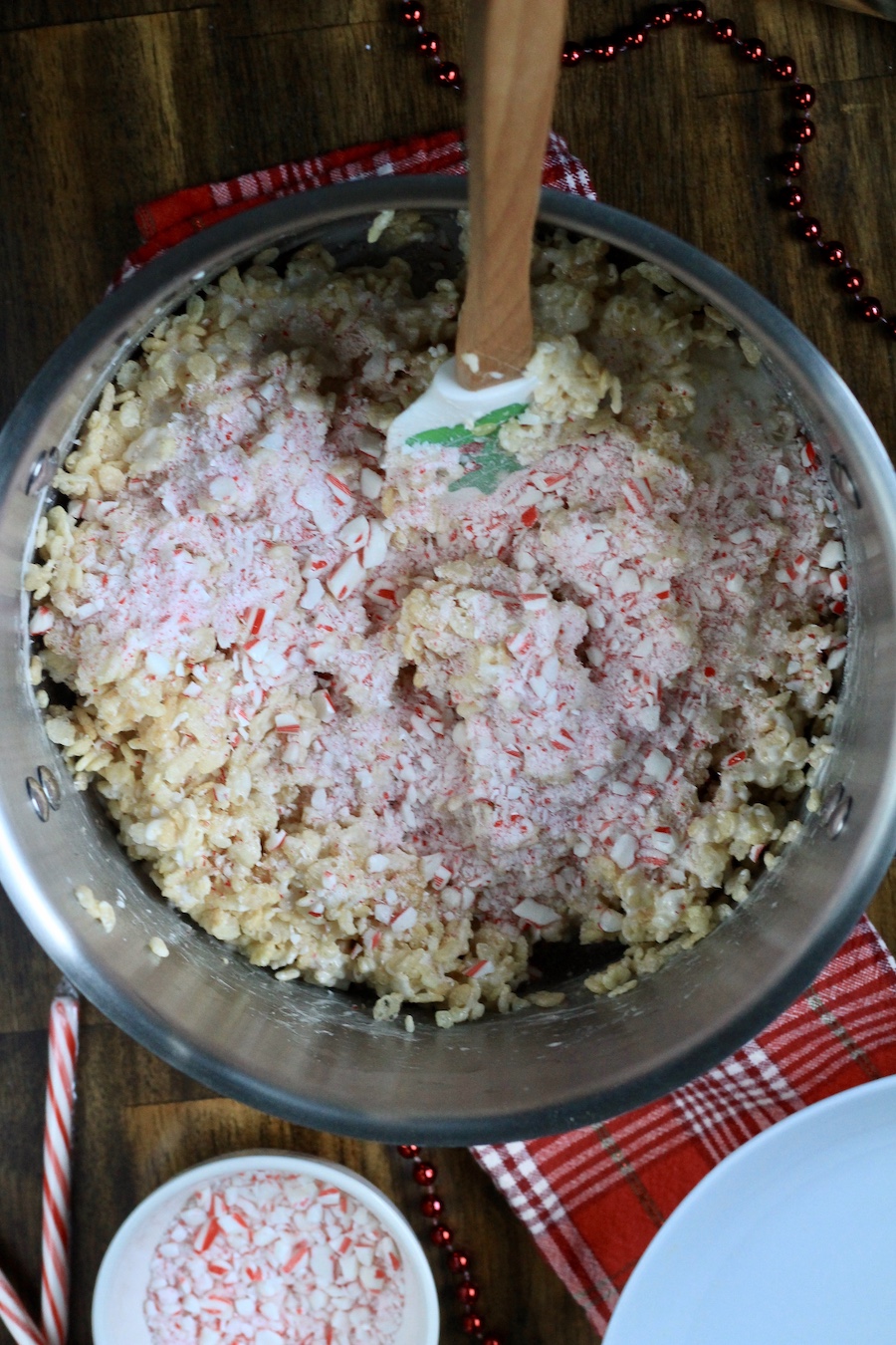 Crushed peppermint tops the rice krispie treat mixture in a silver pot.