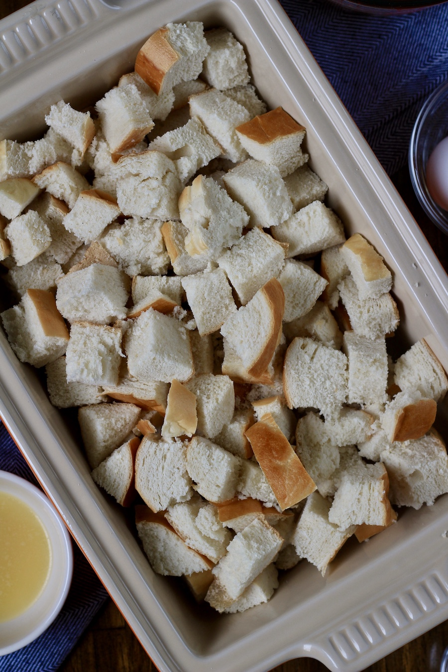 Chopped stale bread in a baking dish.