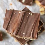 A top down picture of chocolate peanut butter toffee on parchment paper.