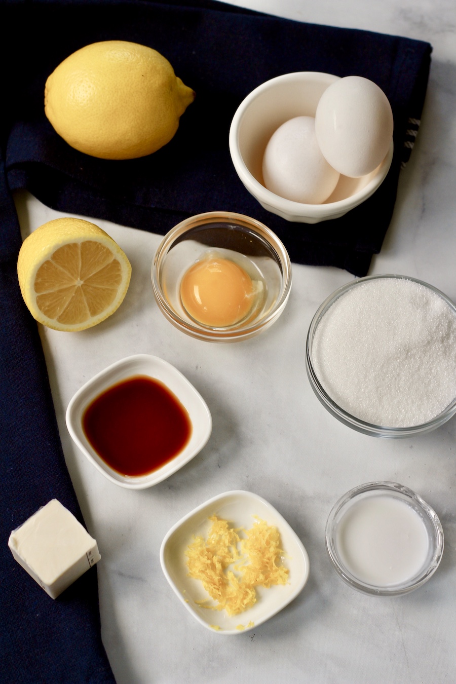 Ingredients for lemon curd on a counter.