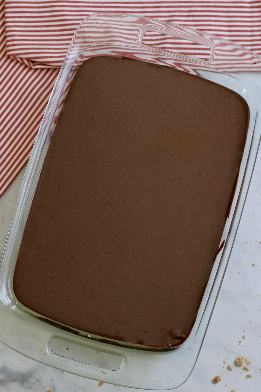 Chocolate eclair dessert after the melted chocolate is poured on top.