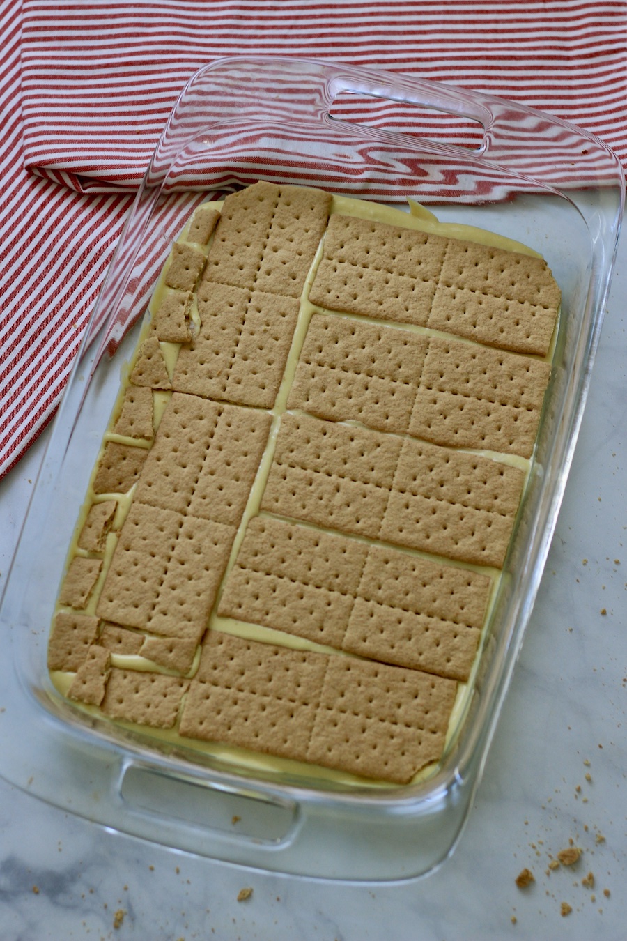 The second layer of graham crackers on top.