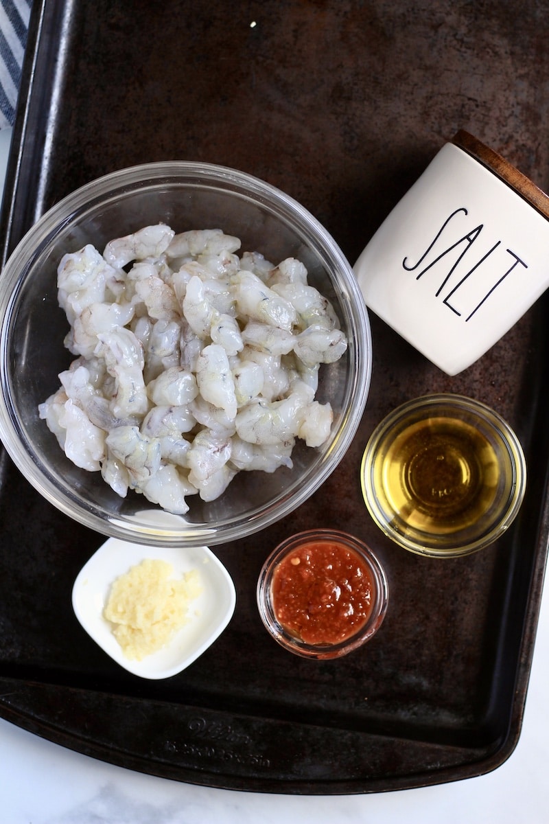 Ingredients for the chili garlic shrimp on a metal baking sheet.