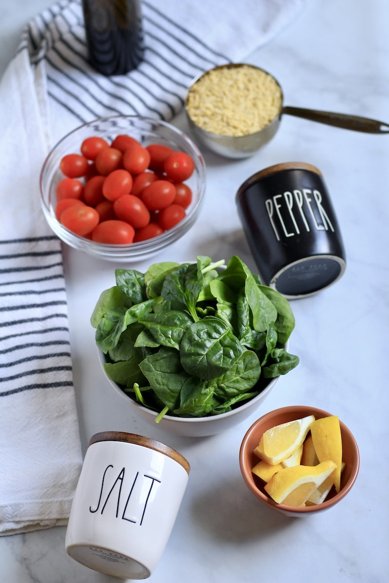Ingredients for lemon orzo pasta salad on a counter.