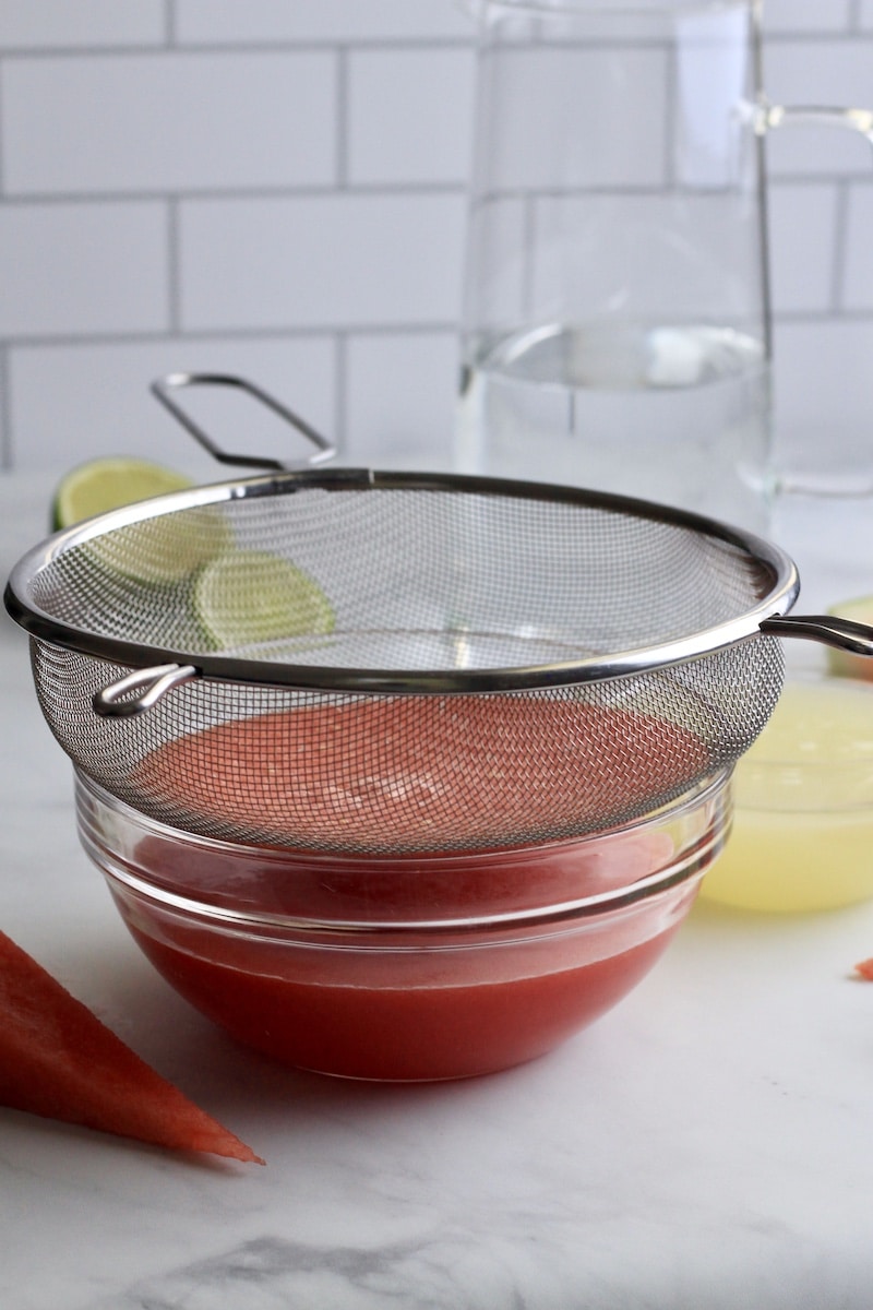 From the side picture of the watermelon juice being strained.