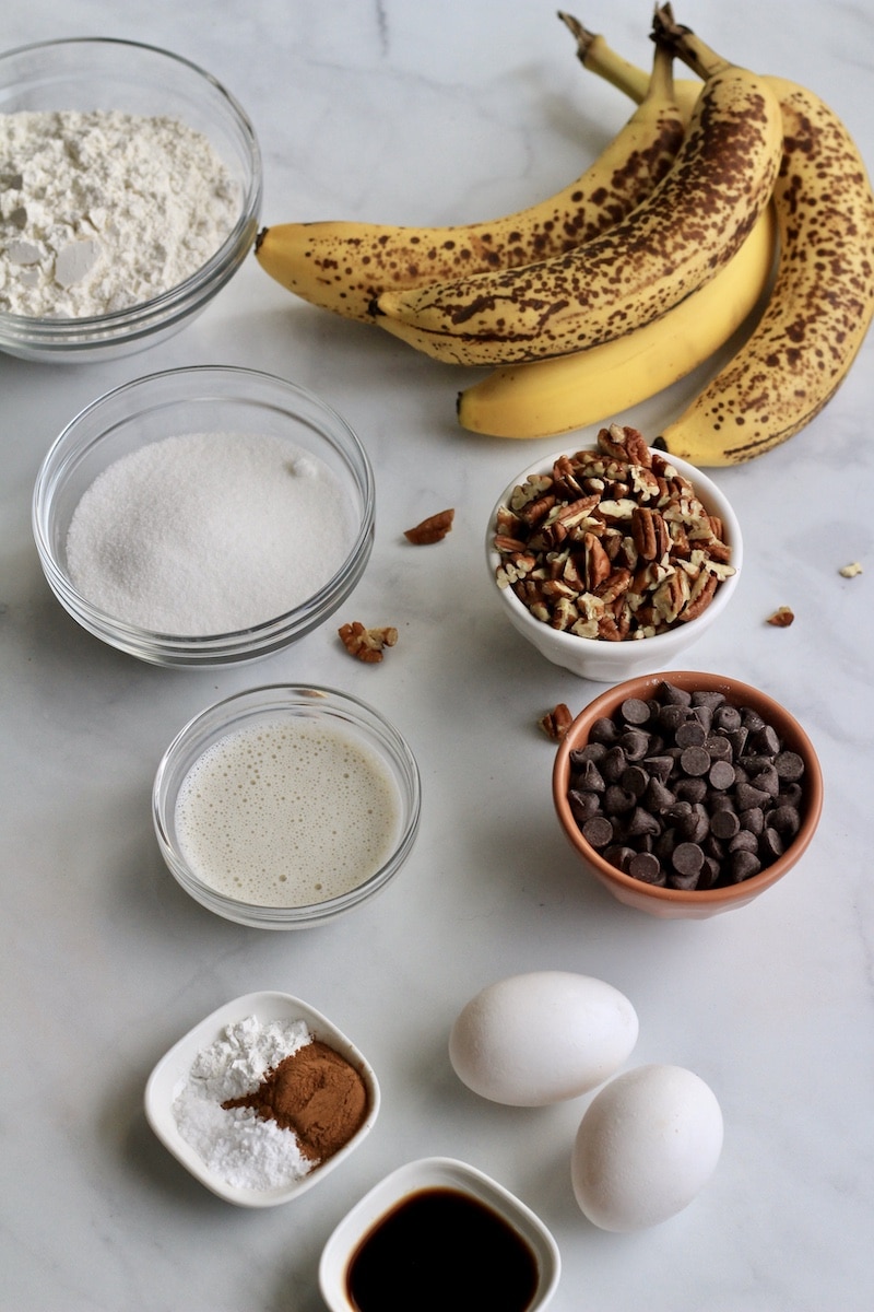 Ingredients for chunky monkey banana muffins on a counter.