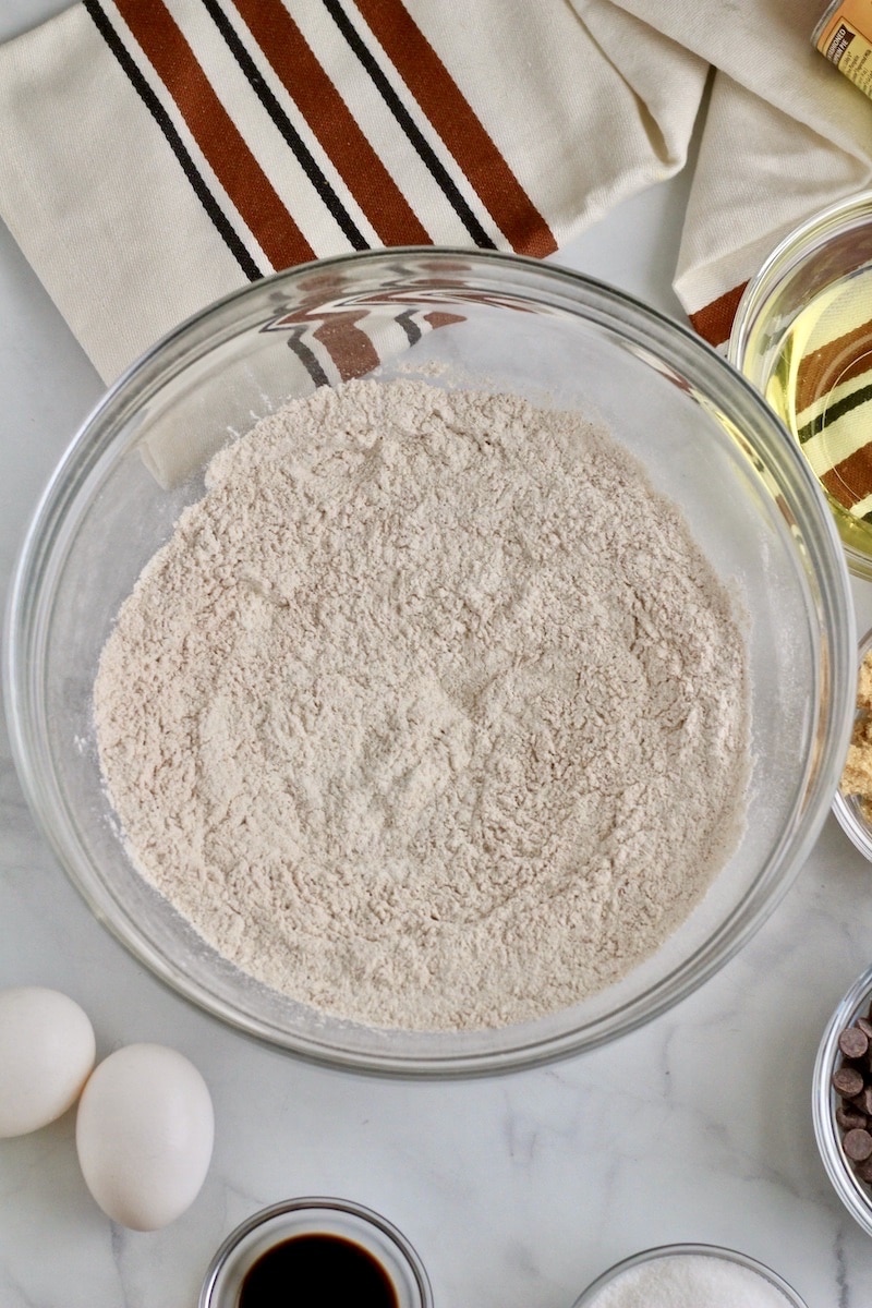 A glass bowl with the mixed dry ingredients.