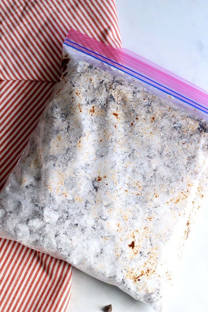 A gallon ziplock with cookie butter muddy buddies after shaking.