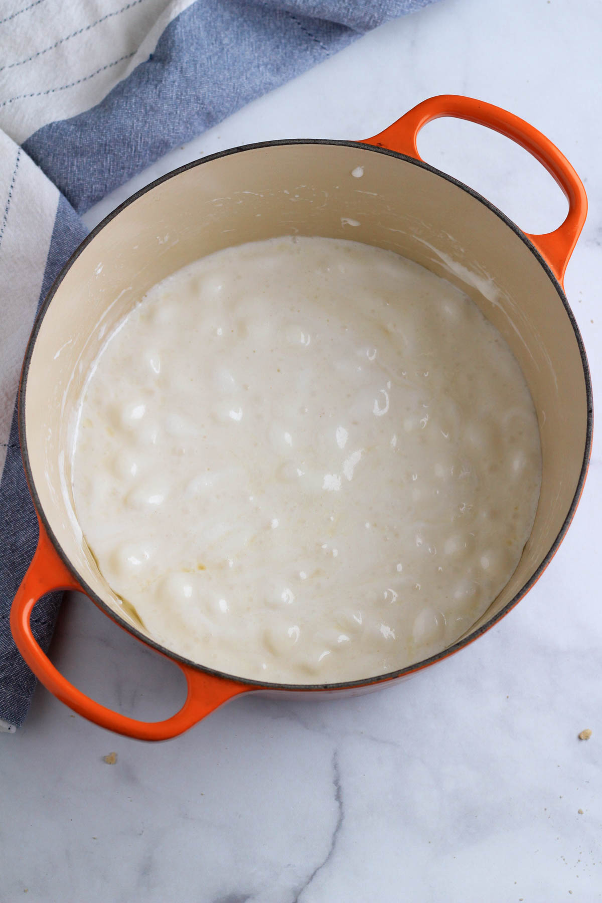 A large orange pot with melted marshmallows.