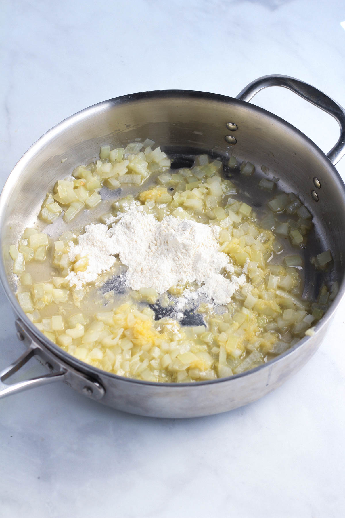 Flour added to the skillet to begin making the roux.
