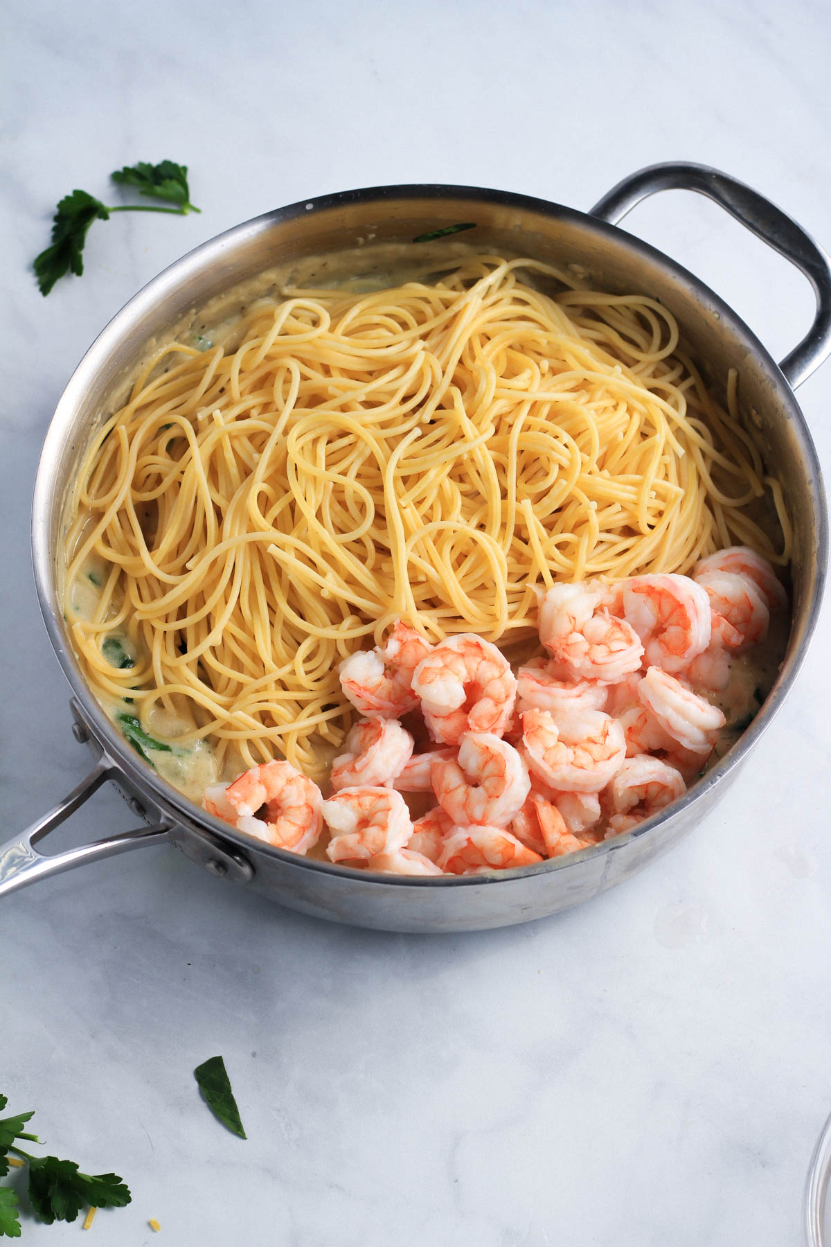 Spaghetti and shrimp before mixing with the garlic cream sauce.