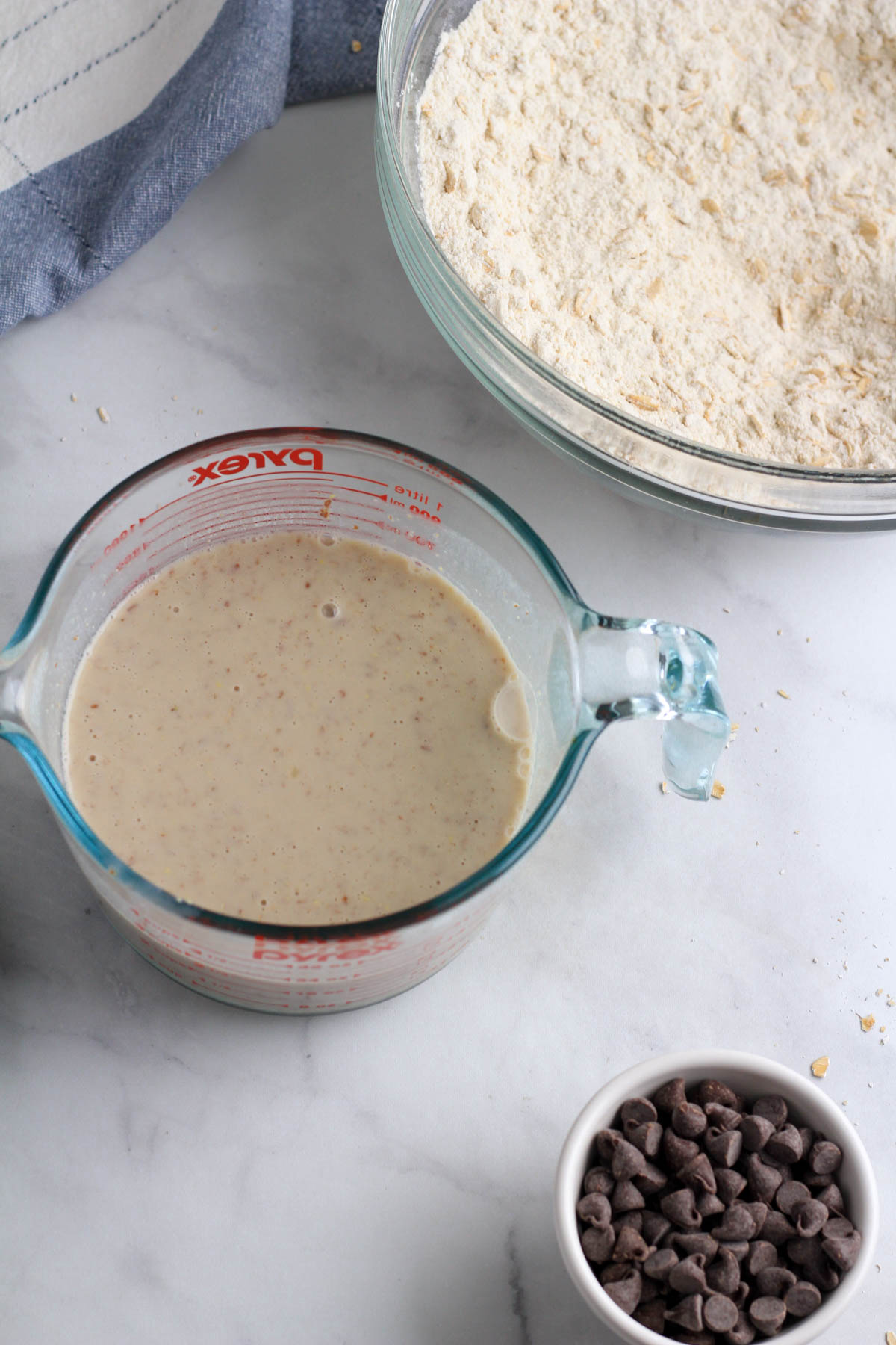 A liquid measuring cup with all of the liquid ingredients mixed together.