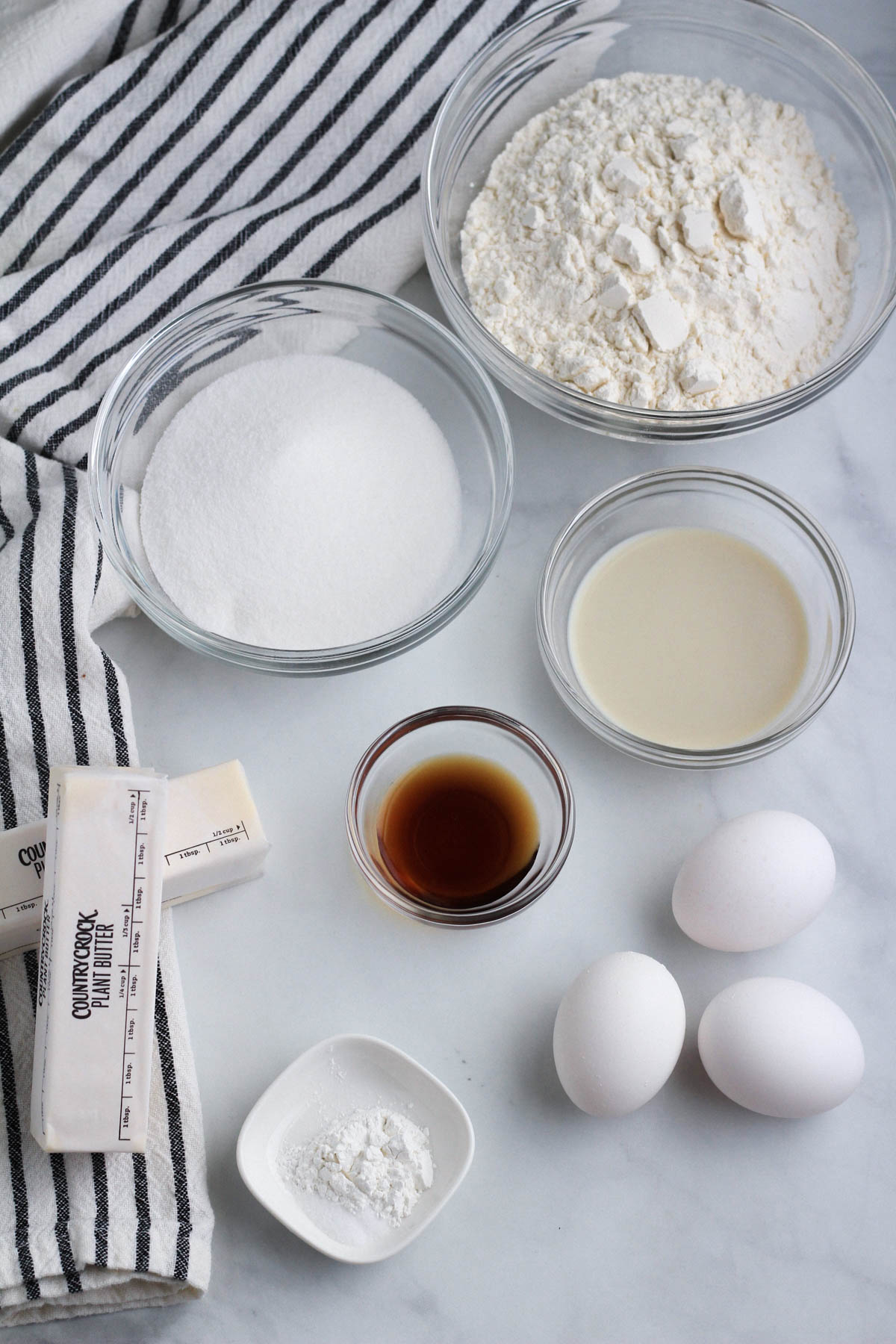 Ingredients for classic vanilla pound cake on a counter.