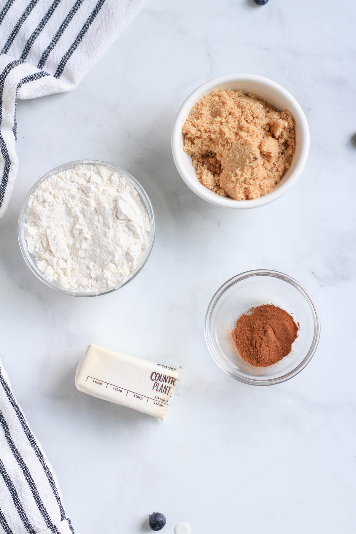 Ingredients for the coffee cake crumble topping on a white counter.