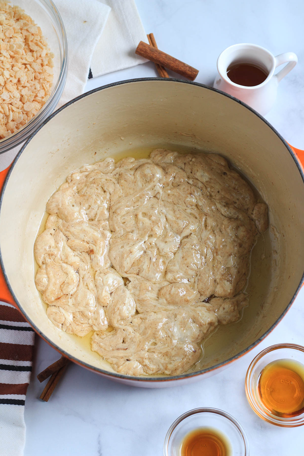 A pot with melted plant-based butter and maple marshmallows.
