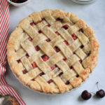 A close up of the vegan cherry apple pie in the pie pan after baking.