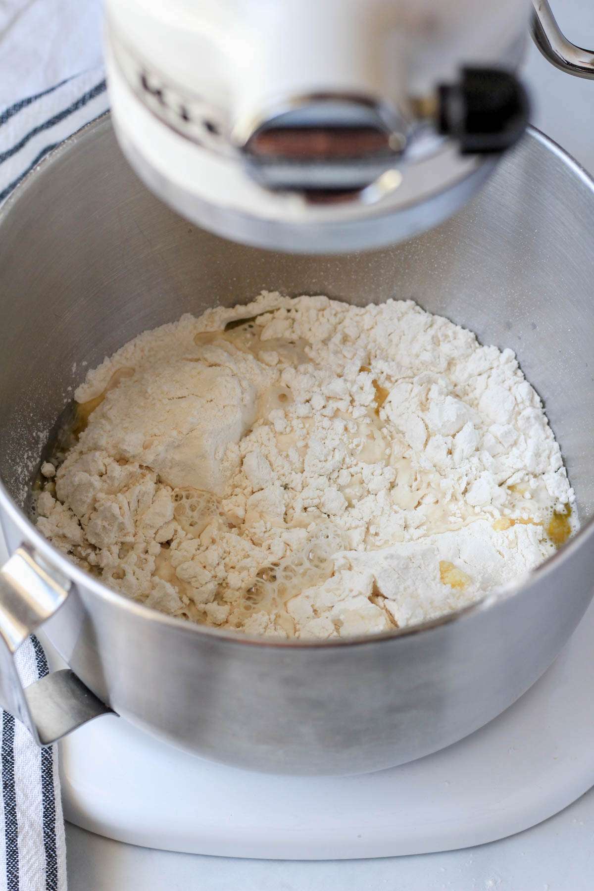 A mixing bowl with all of the ingredients for focaccia before mixing.