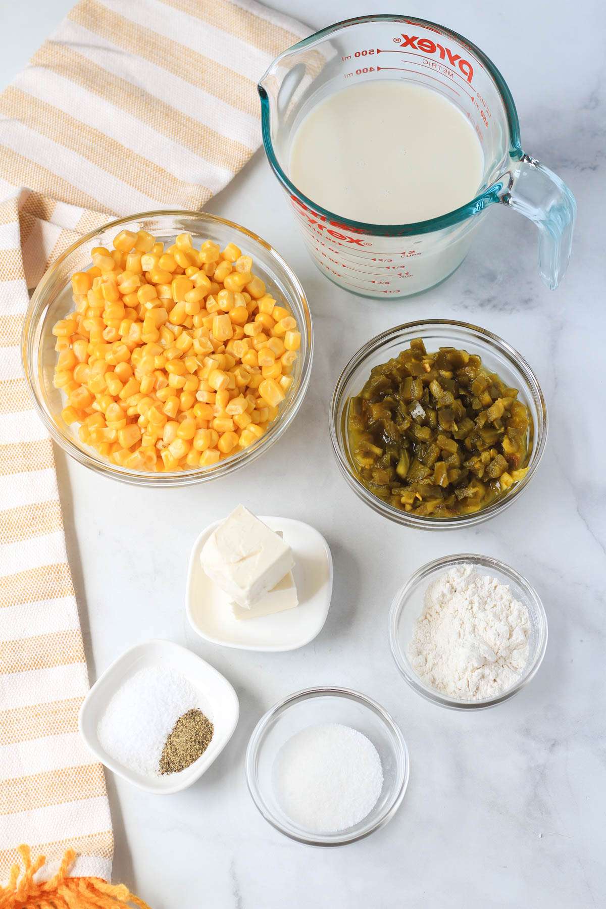 Ingredients for jalapeño creamed corn on a white counter.
