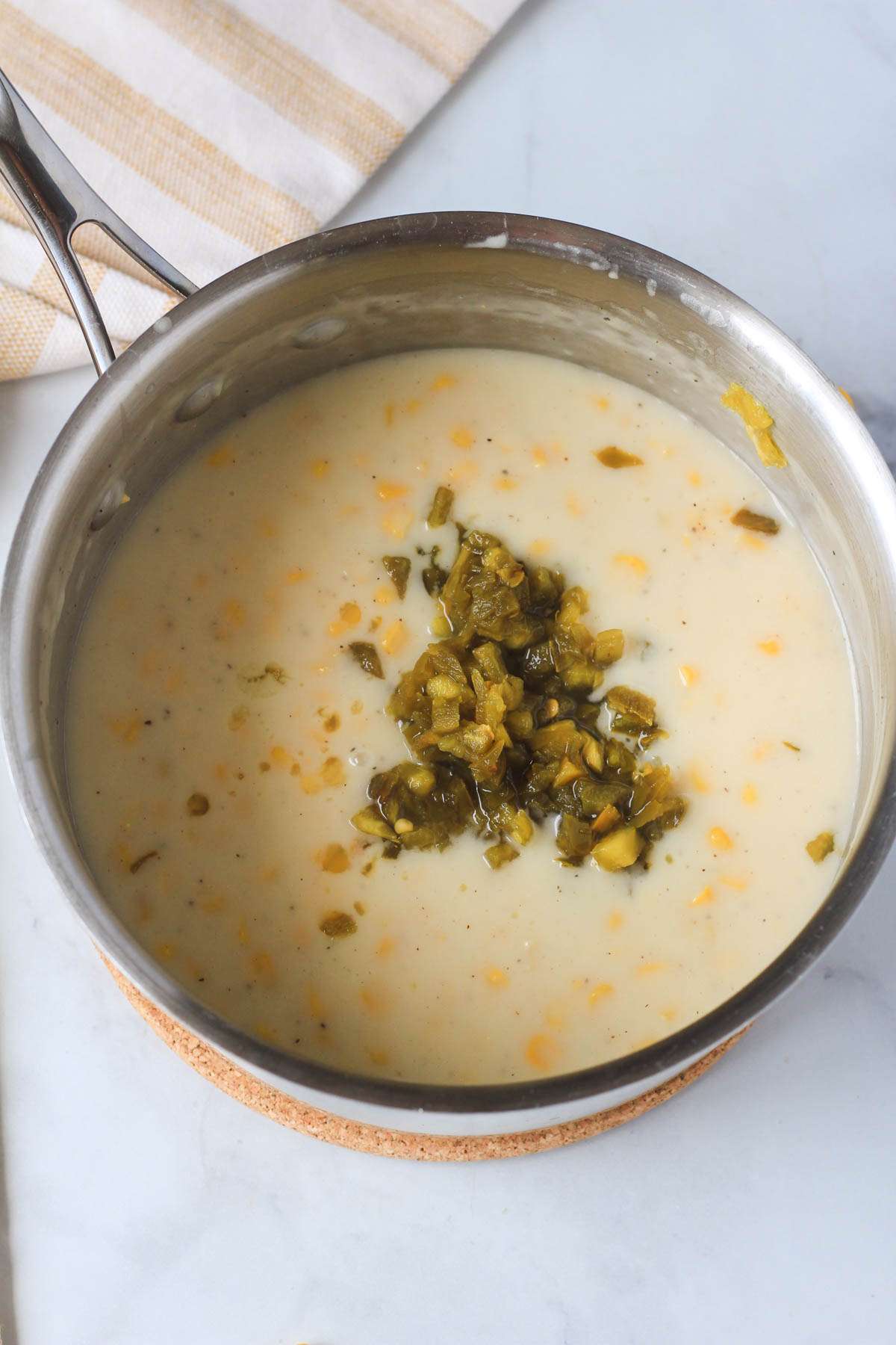 Jarred jalapeño before being mixed into vegan creamed corn.