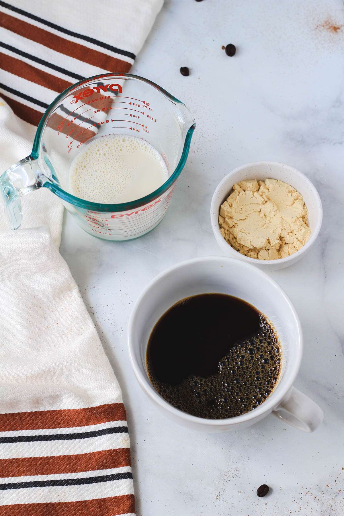 Ingredients for vanilla proffee on a white counter.