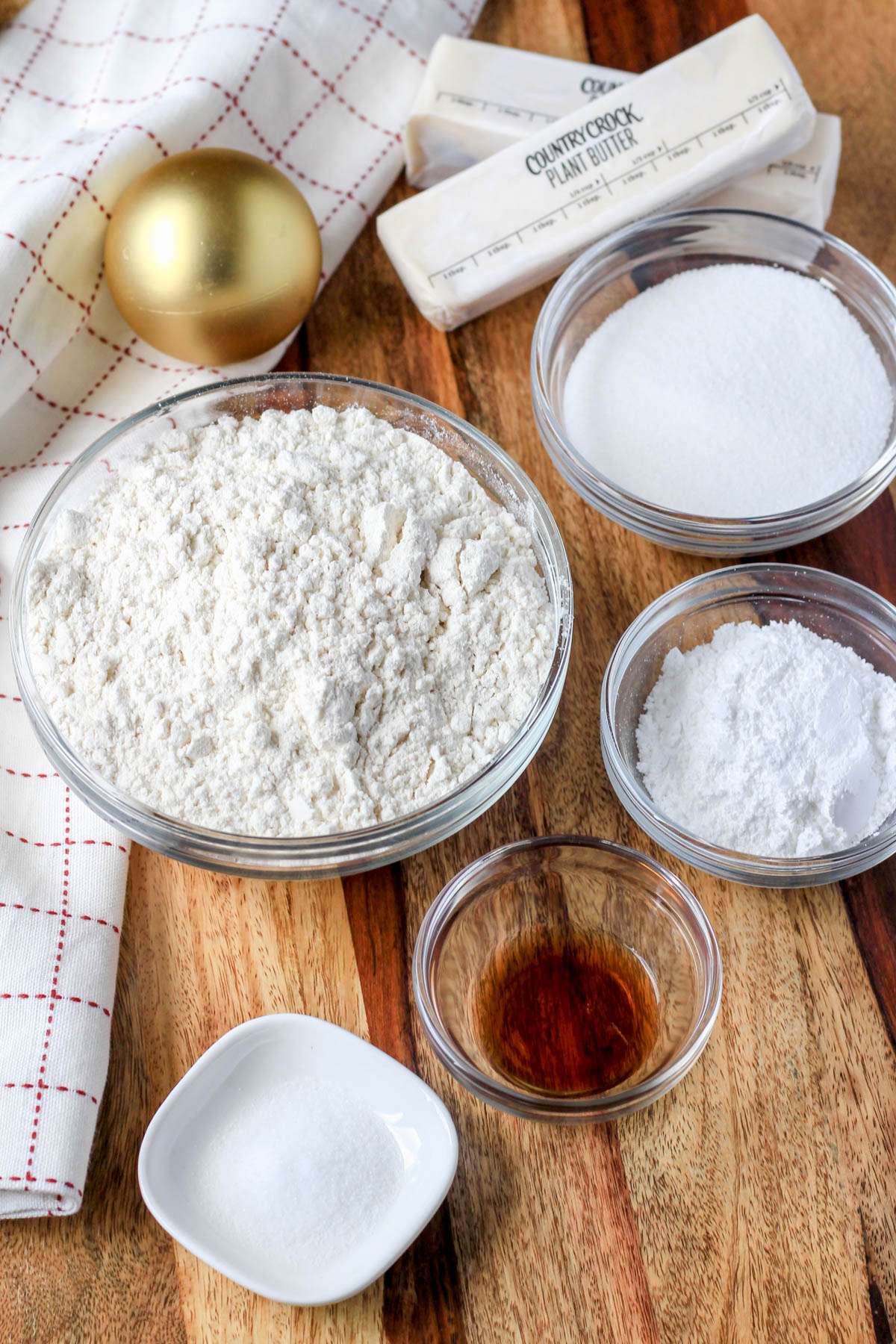 Ingredients for vegan shortbread on a wooden counter.