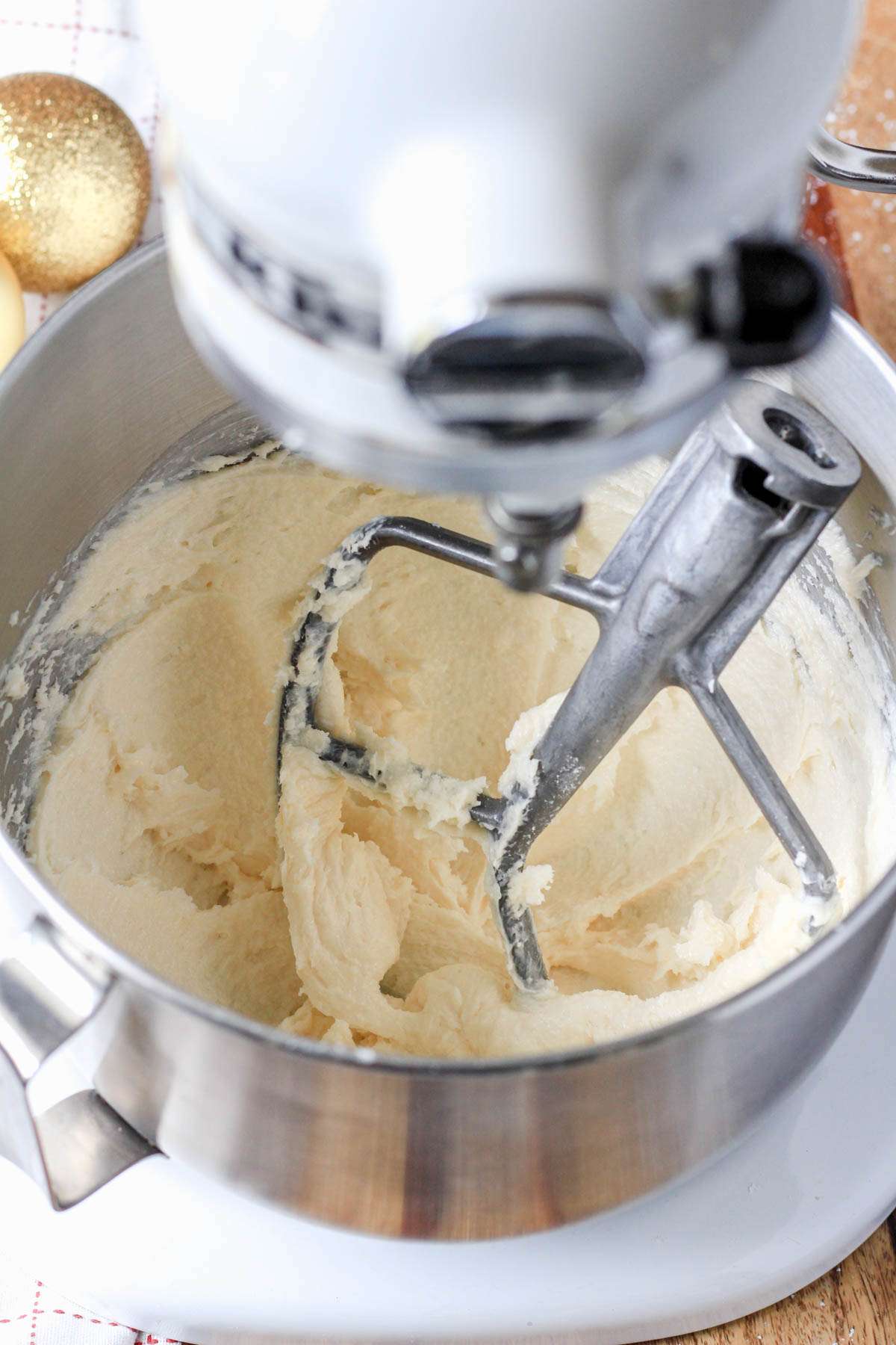 A mixing bowl with creamed vegan butter and sugar.