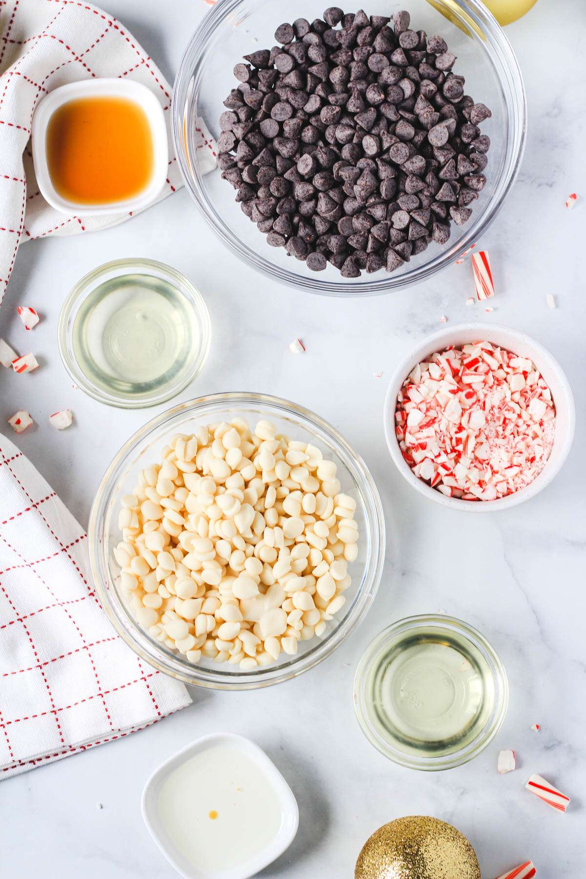 Ingredients for vegan peppermint bark on a white counter.