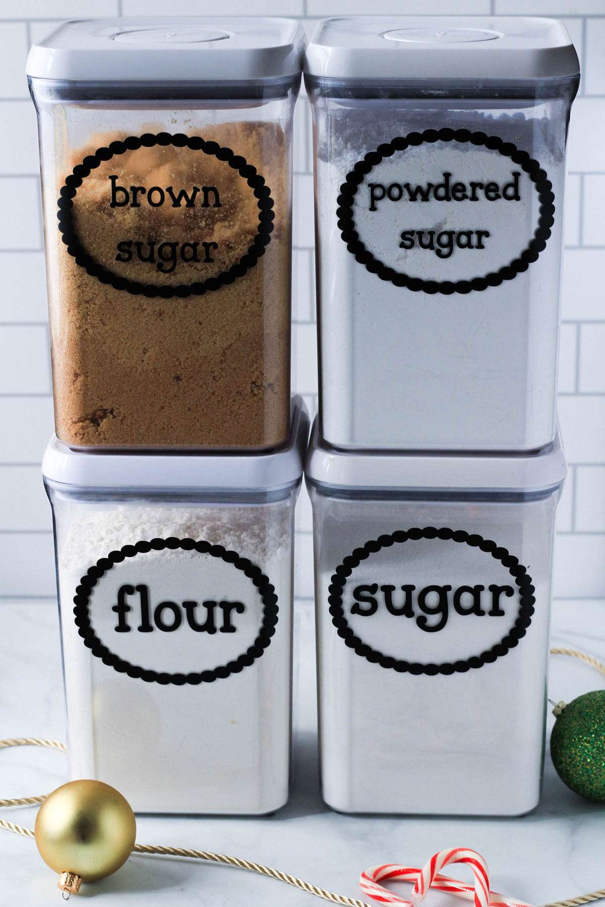 Dry pantry ingredients in plastic canisters for holiday baking.