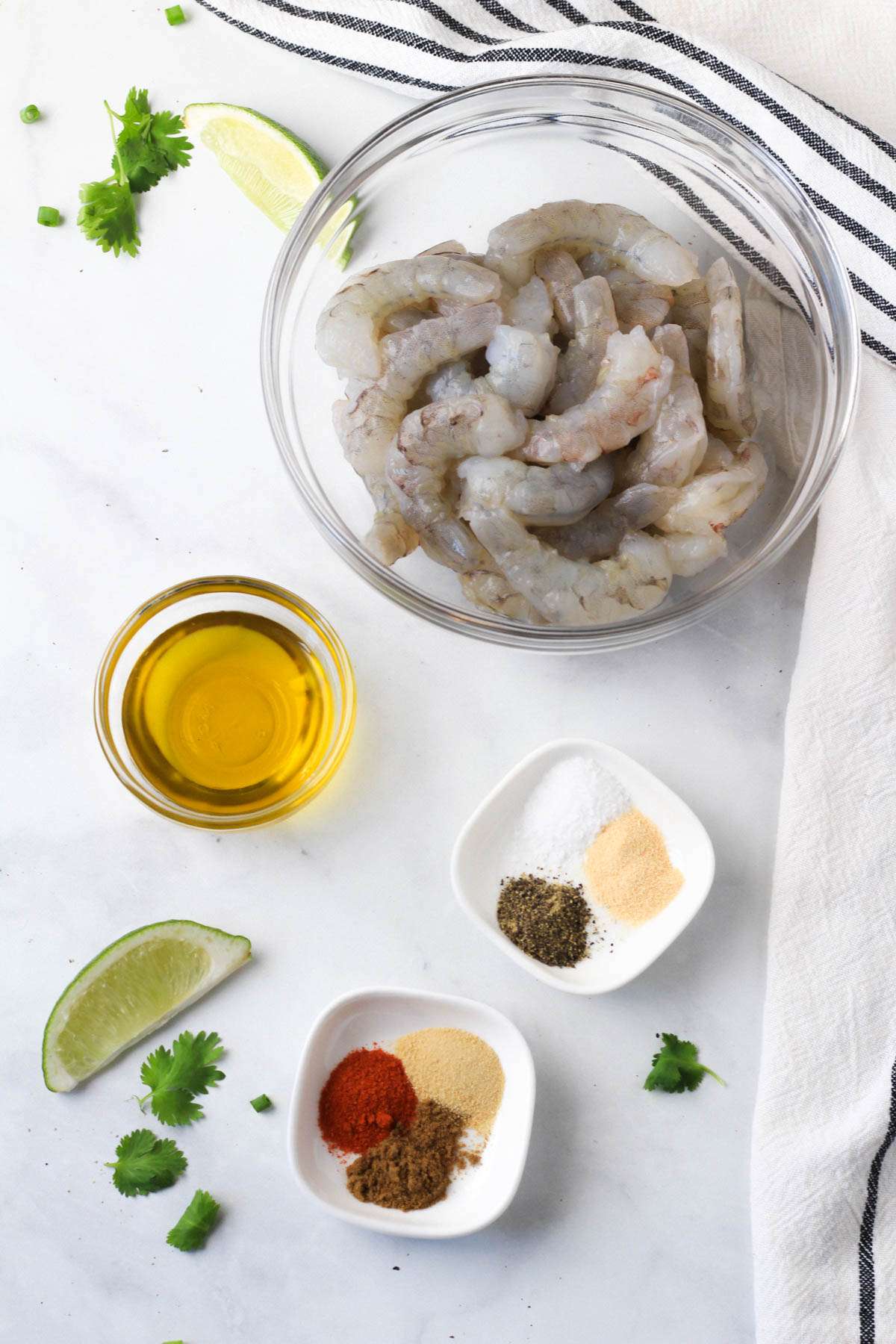 Ingredients for the shrimp marinade on a white counter.