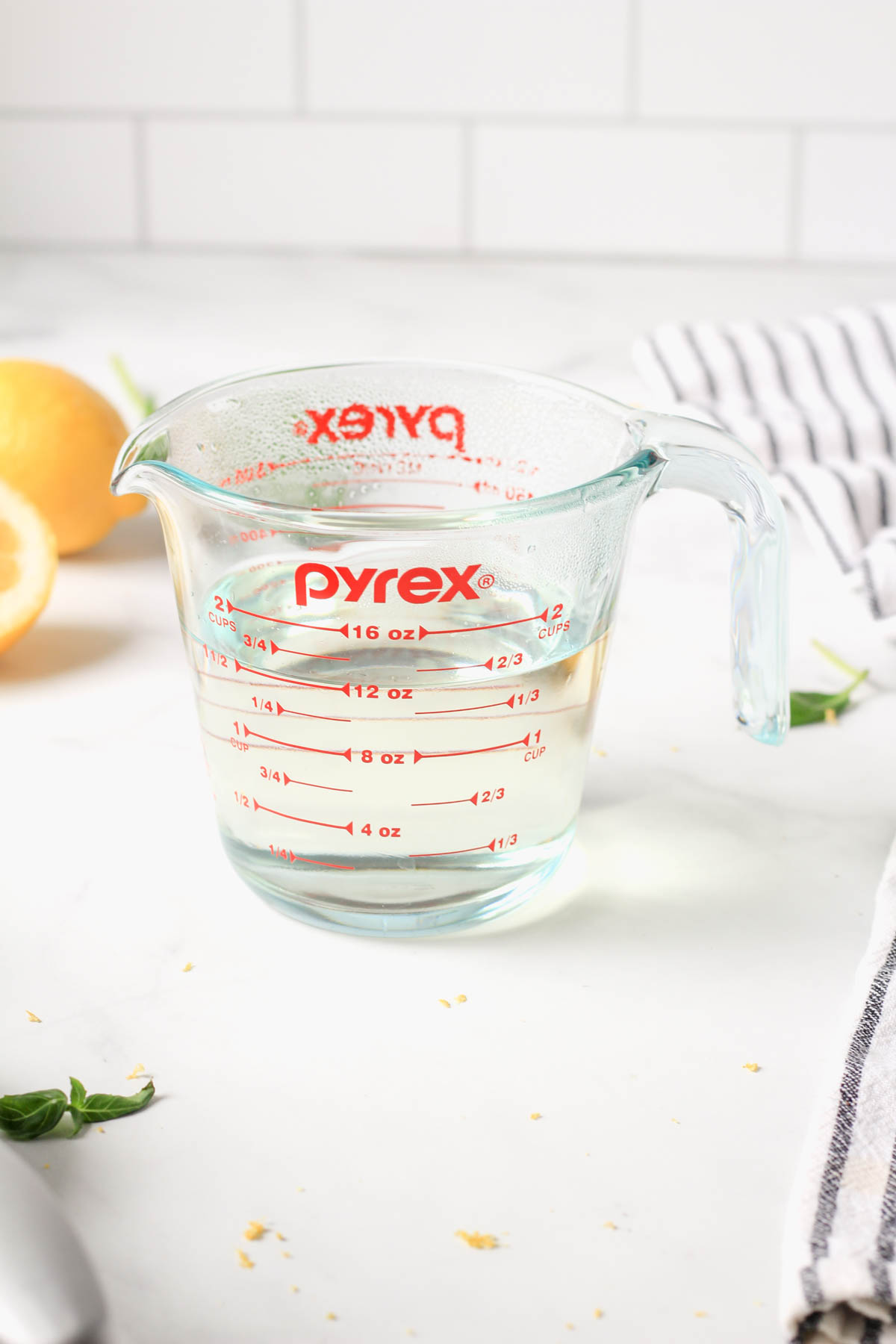 A liquid measuring cup with simple syrup after cooking.