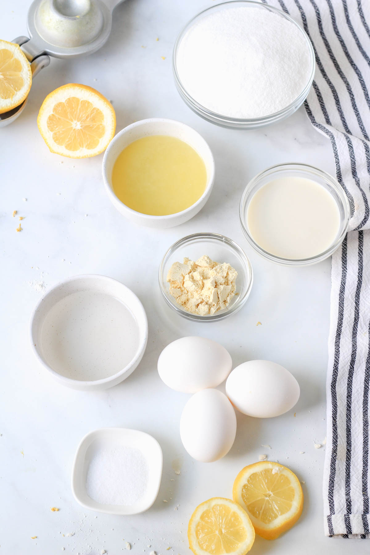 Ingredients for lemon chess pie on a white counter.