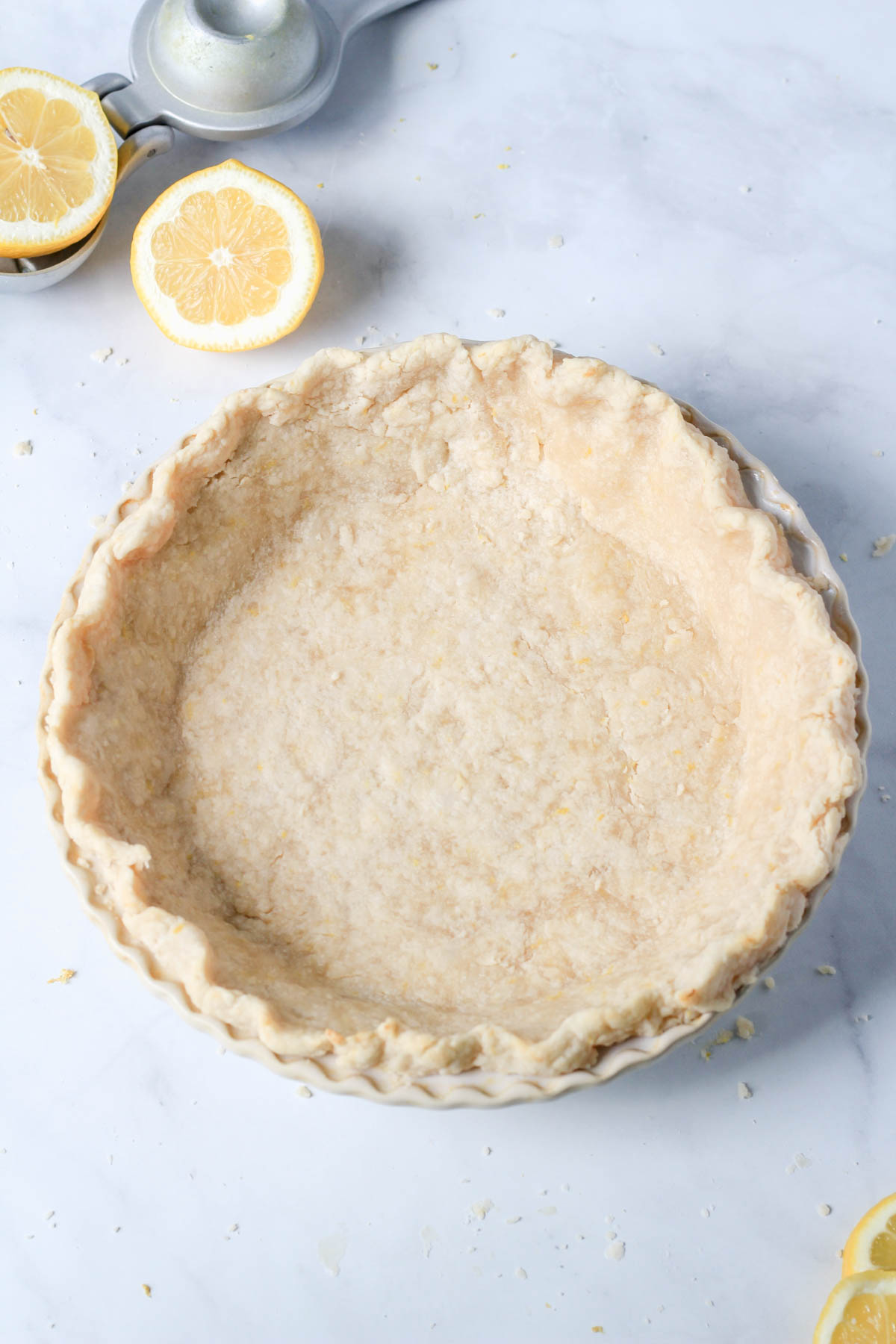 Lemon pie crust after a partial bake in the oven.