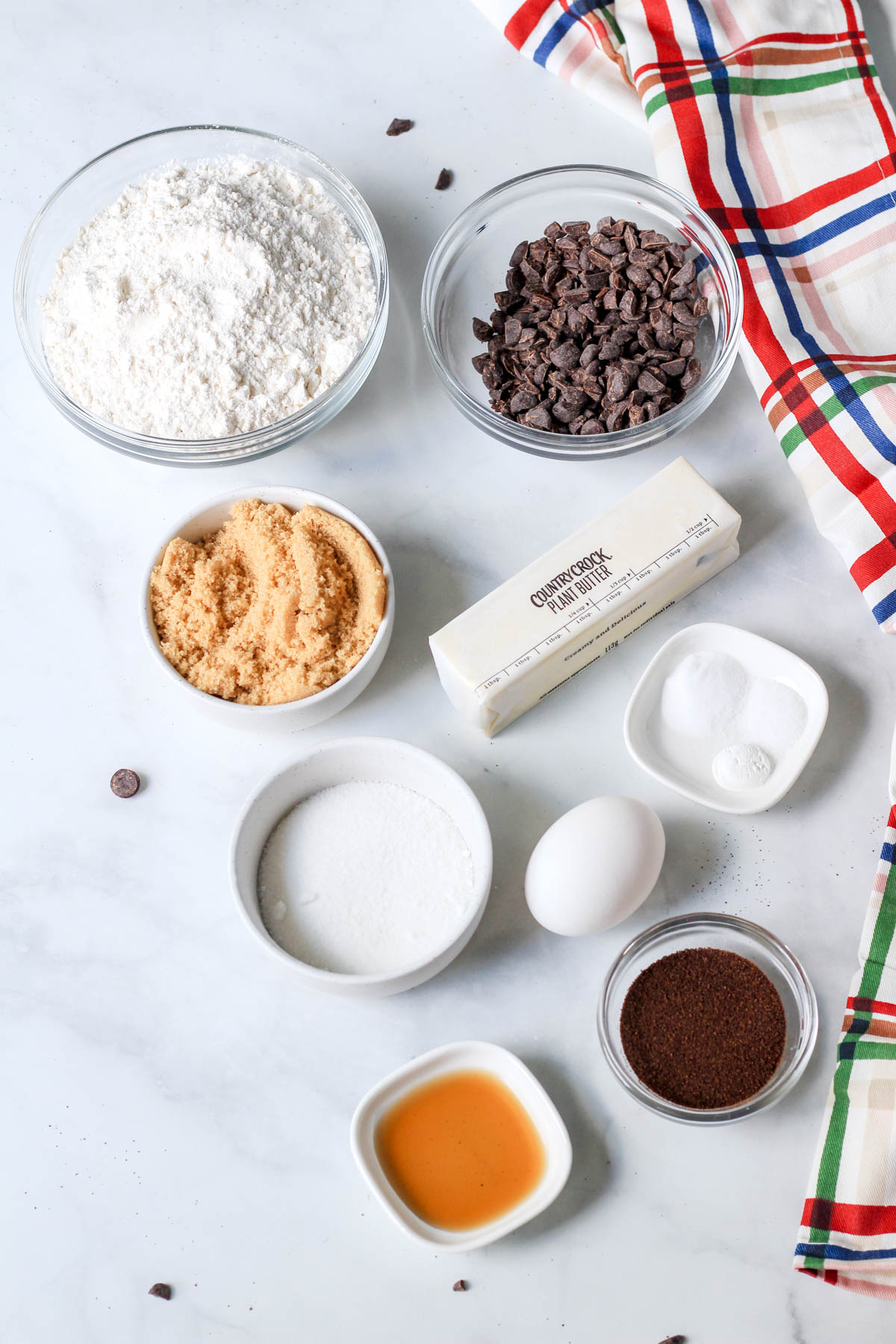 Ingredients for coffee chip ice cream pie on a white counter.