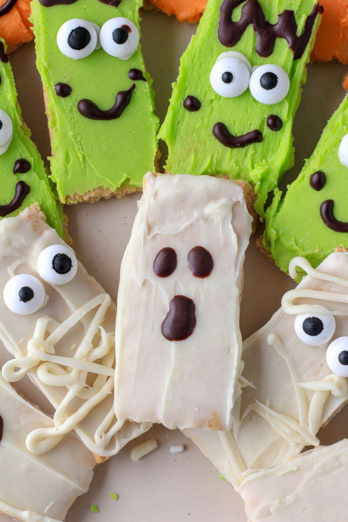 A ghost decorated white chocolate dipped graham cracker.