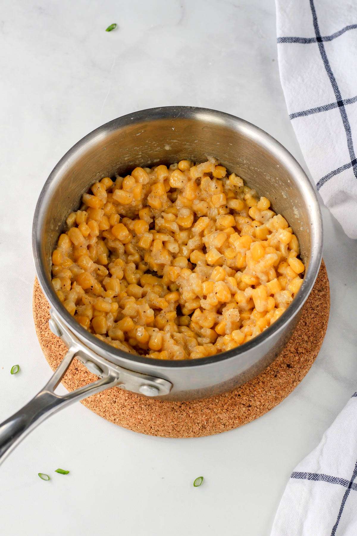 The base of the creamed corn in a sauce pan before adding the heavy cream.
