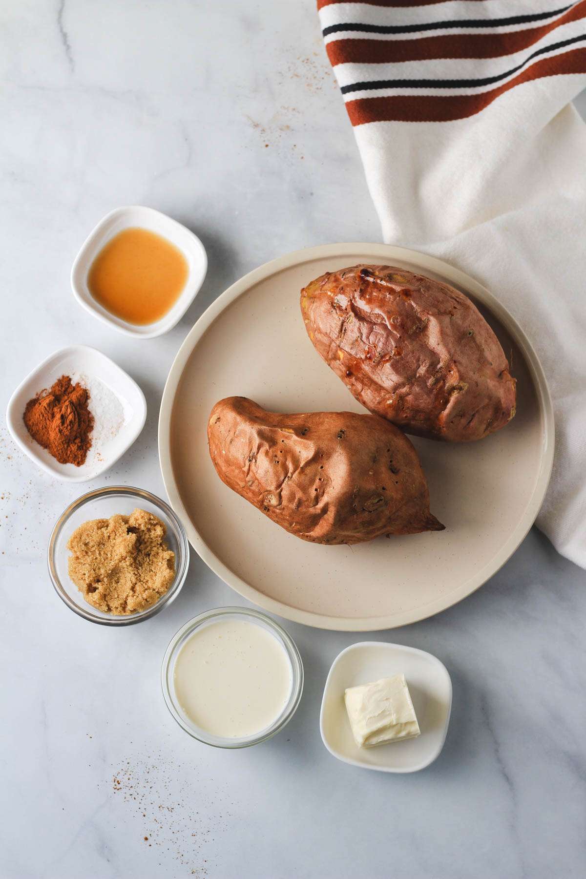 Ingredients for vegan twice baked sweet potatoes on a white counter.