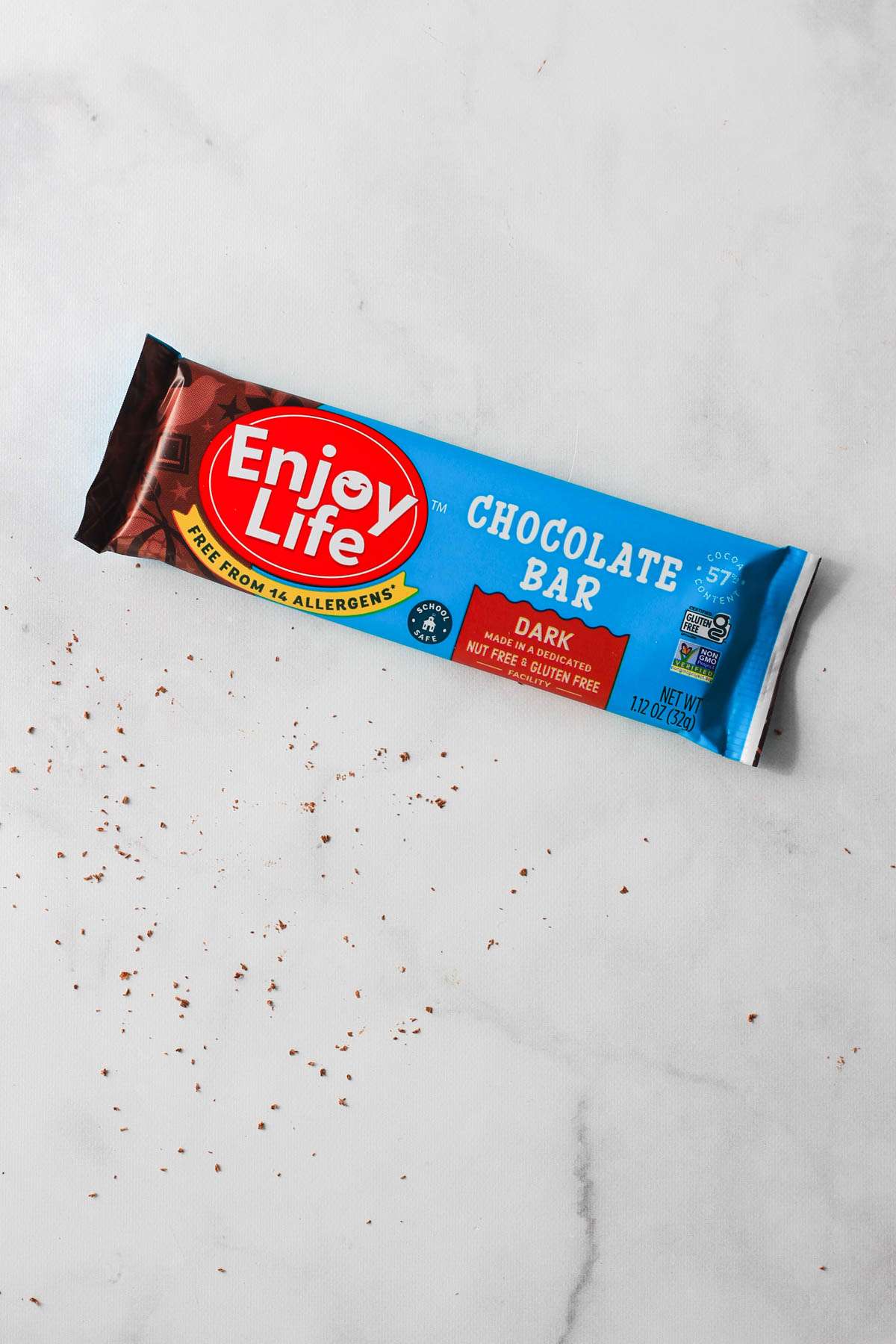 A bar of Enjoy Life dairy-free chocolate for Valentine's Day on a white counter.