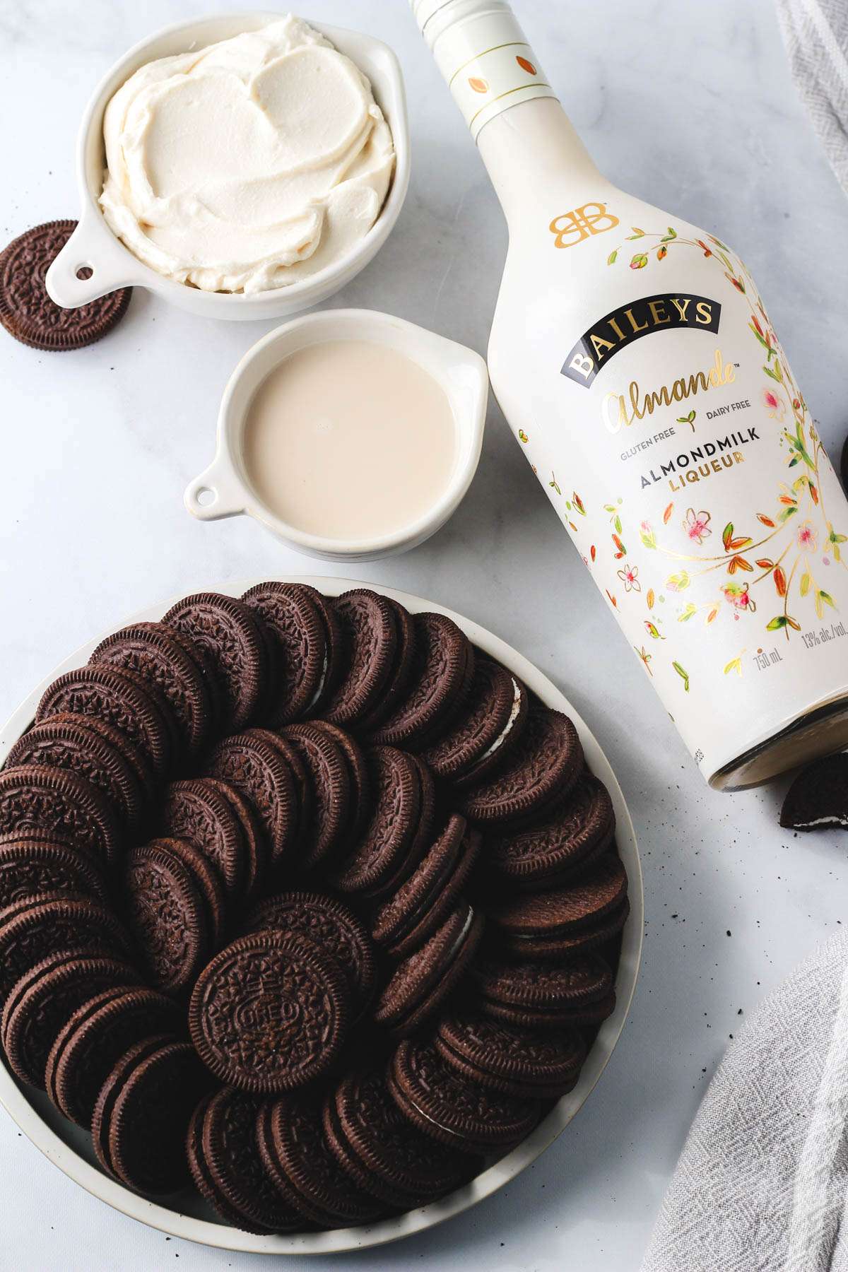 Ingredients for vegan Irish cream truffles on a white counter.