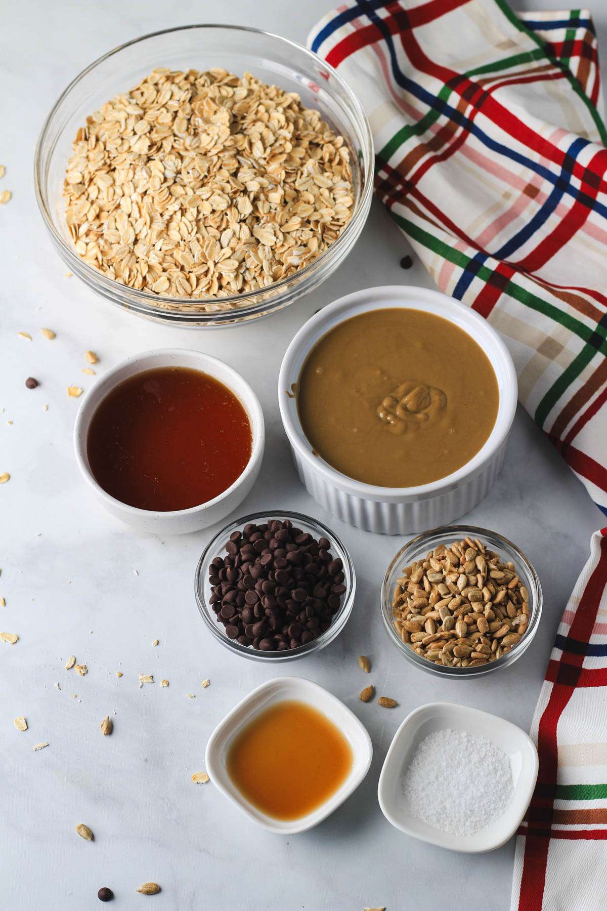 Ingredients for nut-free granola bars on a white counter.