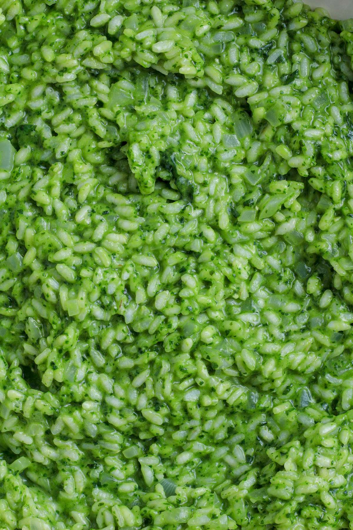 A top down image of vegan pesto risotto.